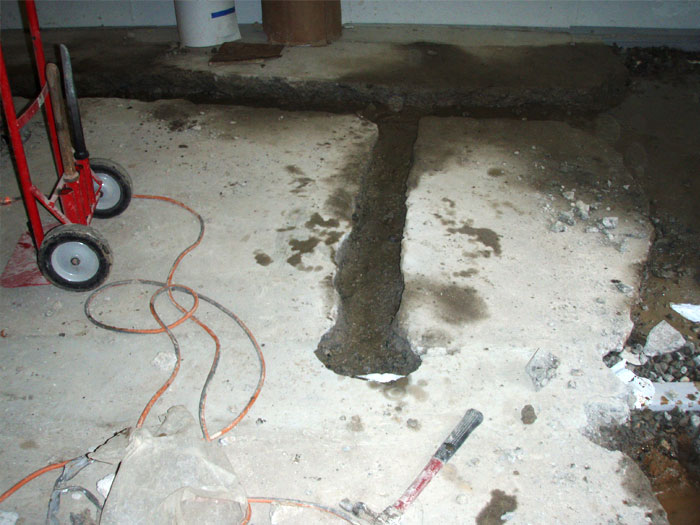 drain lateral basement channel install leaky leaking line causes basements floors drainage perimeter fixing